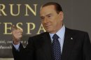 Former Italian Prime Minister Silvio Berlusconi gestures as he arrives to attend the book launch of his friend, TV presenter Bruno Vespa, in Rome