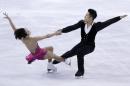 Wenjing Sui and Cong Han, of China, compete during the pairs short program in the World Figure Skating Championships, Friday, April 1, 2016, in Boston. (AP Photo/Elise Amendola)
