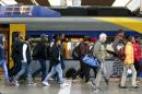 Migrants arrive at main railway station in Munich