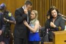 Olympic and Paralympic track star Oscar Pistorius is greeted by a supporter after the first day of his sentencing hearing at the North Gauteng High Court in Pretoria