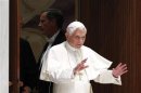 Pope Benedict XVI waves as he arrives to lead a special audience for members of Interpol taking part in the 81st Interpol General Assembly at the Vatican