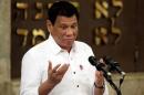Philippine President Rodrigo Duterte gestures during his speech at the Beit Yaacov Synagogue, The Jewish Association of the Philippines in Makati city, metro Manila