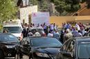 An ambulance transports the body of Jordanian writer Nahed Hattar to a medical facility, after he was shot, in Amman, Jordan, Sunday, September 25, 2016. The prominent writer was shot dead in front of the courthouse where he was on trial for sharing a cartoon deemed as offensive to Islam. (AP Photo/Raad Adayleh)