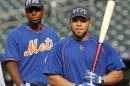 New York Mets players, including John Mayberry Jr., and Johnny Monell, wear New York Police Department hats in memory of slain New York City police officer Brian Moore before a baseball game against the Baltimore Orioles in New York, Tuesday, May 5, 2015. Moore died Monday after he was shot in the face while on duty Saturday. (AP Photo/Kathy Willens)