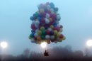 In this photo provided by Mark McBreairty, a balloon cluster carrying Jonathan Trappe lifts off from Caribou, Maine, Thursday, Sept. 12, 2013. Unlike a conventional hot-air balloon, Trappe lifted off Thursday using hundreds of helium-filled balloons clustered together. Trappe hopes to be the first person to successfully complete a trans-Atlantic flight using the balloon cluster. (AP Photo/Mark McBreairty)