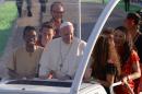Pope Francis and young representatives of every continent arrive with the popemobil on July 30, 2016 on the Campus Misericordiae in Brzegi, Poland, ahead of a prayer Vigil, as part of the World Youth Days (WYD)