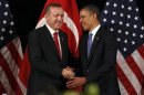 U.S. President Obama shakes hands with Turkey's PM Erdogan in Seoul