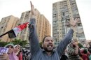 Supporters of deposed Egyptian President Mursi take part in a protest during a symbolic funeral for the four men killed during clashes with police outside the Republican Guard headquarters a day earlier, in Cairo