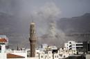 Smoke rises during an air strike on an army weapons depot on a mountain overlooking Sanaa