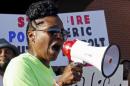 A woman speaks during a protest against what demonstrators call police brutality in McKinney, Texas