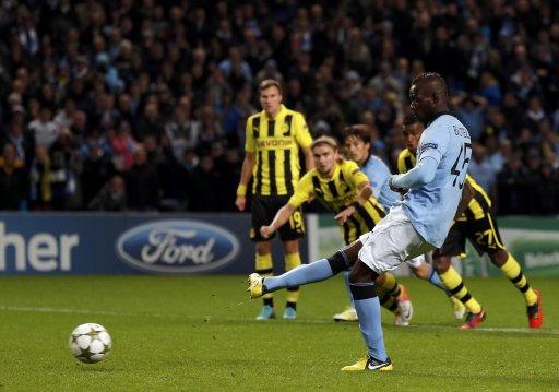 Manchester City's Balotelli scores a penalty kick against Borussia Dortmund during their Champions League Group D soccer match in Manchester