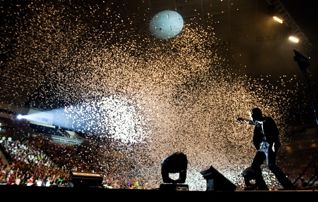Confetti sprays on the crowd in a rousing end to the concert. (Photo courtesy of Running Into The Sun)