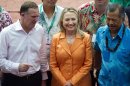 US Secretary of State Hillary Clinton, center, speaks with New Zealand Prime Minister John Key, left, and Cook Island Prime Minister Henry Puna, right, while posing for the family photo during the Pacific Island Forum Post-Forum Dialogue in Rarotonga, Cook Islands, Friday, Aug. 31, 2012. (AP Photo/Jim Watson, Pool)