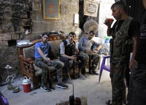 Free Syrian Army fighters rest as they drink tea in …