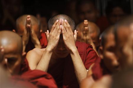 Rakhine Buddhist monks pray …