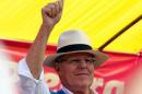 Peru's presidential candidate Pedro Pablo Kuczynski greets suporters during a campaign rally in Puente Piedra in Lima