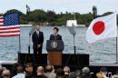 Japanese Prime Minister Shinzo Abe give remarks as U.S. President Barack Obama listens at Kilo Pier overlooking the USS Arizona Memorial at Joint Base Pearl Harbor-Hickam in Honolulu