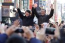 South Korea's presidential candidate Moon Jae-in of the main opposition Democratic United Party attends his campaign rally with former independent presidential candidate Ahn Cheol-soo in Daejeon