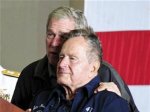 US Navy handout photo of George W. Bush and George H.W. Bush onboard the USS George H.W. Bush aircraft carrier