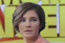 Amanda Knox prepares to leave the set following a television interview, Friday, Jan. 31, 2014 in New York. Knox said she will fight the reinstated guilty verdict against her and an ex-boyfriend in the 2007 slaying of a British roommate in Italy and vowed to "never go willingly" to face her fate in that country's judicial system . "I'm going to fight this to the very end," she said in an interview with Robin Roberts on ABC's "Good Morning America." (AP Photo/Mark Lennihan)