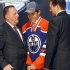 Nail Yakupov, center, a winger from Russia who was chosen first overall by the Edmonton Oilers in the first round of the NHL hockey draft,  stands with Oilers officials on Friday, June 22, 2012, in Pittsburgh. (AP Photo/Keith Srakocic)