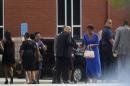 Mourners arrive for the funeral of Kristina Bobbi Brown, the only child of singer Whitney Houston at Saint James United Methodist Church in Alpharetta