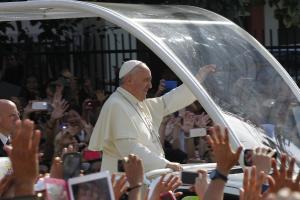 Pope Francis waves to the faithful on his last drive …