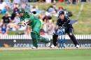Bangladesh's Nurul Hasan (L) bats as New Zealand's wicketkeeper Luke Ronchi looks on during their third ODI match, at Saxton Oval in Nelson, on December 31, 2016