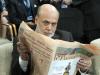 Ben Bernanke, chairman of the Federal Reserve, reads a newspaper before a meeting of the IMFC, during the World Bank/IMF Annual Meetings at IMF headquarters, Saturday, Oct. 12, 2013, in Washington. World finance officials prepared to wrap up three days of meetings in Washington, where fretting about the risk of an unprecedented U.S. debt default overshadowed myriad worries about a shaky global economic recovery. ( AP Photo/Jose Luis Magana)