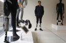 Professor Herr, who heads the Biomechatronics research group at the MIT Media Lab, stands amid mannequins displaying various bionic limbs his lab has developed at the Massachusetts Institute of Technology in Cambridge
