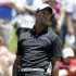 Tiger Woods reacts after missing a birdie putt on the first hole during the second round of the Players Championship golf tournament at TPC Sawgrass, Friday, May 11, 2012, in Ponte Vedra Beach, Fla. (AP Photo/John Raoux)