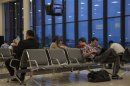 People spend time in a waiting room at the transit area of Moscow's Sheremetyevo airport