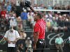 Woods reacts after his final putt on the 18th green during final round play in the 2013 WGC-Cadillac Championship PGA golf tournament in Doral