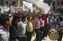 Demonstrators protest against Syria's President Bashar al-Assad in Binsh near Idlib