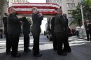 The casket containing the body of U.S. Sen. Frank Lautenberg is carried into the Park Avenue Synagogue in New York, Wednesday, June 5, 2013. Lautenberg's nearly three decades in office and the causes he championed will be remembered at a funeral service in New York. (AP Photo/Seth Wenig)