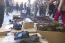 Members of the Free Syrian Army stand near weapons they say were gained from forces loyal to Syria's President Bashar al-Assad, in Aleppo