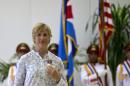 U.S. endurance swimmer Diana Nyad wears her Order of Sporting Merit medal as she stands in front of the Cuban and U.S. flags during a ceremony in Havana, Cuba, Saturday, Aug. 30, 2014. Cuba honored Nyad for being the first swimmer to make the crossing between Cuba and Florida without flippers or a shark cage for protection. Nyad made four previous attempts; first in 1978, and three times in 2011 and 2012. (AP Photo/Ramon Espinosa)
