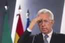 Italy's PM Monti gestures during a news conference at the Moncloa Palace in Madrid