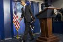 President Barack Obama walks away from the podium after speaking about the ongoing situation in Ukraine in the Brady Press Briefing Room of the White House in Washington, Friday, Feb. 28, 2014. Obama warned Russia "there will be costs" for any military intervention in Ukraine. (AP Photo/Pablo Martinez Monsivais)