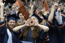 IMAGE DISTRIBUTED FOR SYRACUSE UNIVERSITY - Samantha Blinn, center, and other graduates screram and cheer as they are conferred during the Syracuse University 159th Commencement ceremony in Syracuse, N.Y., Sunday, May 12, 2013. (Kevin Rivoli / AP Images for Syracuse University)