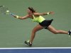 Azarenka of Belarus hits a return to Stosur of Australia during their women's singles quarterfinals match at the U.S. Open tennis tournament in New York