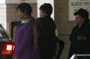 Winnie Mandela, ex-wife of former South African President Nelson Mandela, and her daughter Zindzi leave the Pretoria hospital where Nelson Mandela is being treated