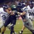 FILE - In this Oct. 9, 2004, file photo, Hawaii's Bryan Maneafaiga (43) scores a touchdown against Nevada in Honolulu. With uneven testing for steroids and inconsistent punishment, college football players are packing on significant weight _ in some cases, 30 pounds or more in a single year _ without drawing much attention from their schools or the NCAA in a sport that earns tens of billions of dollars for teams. But looking solely at the most significant weight gainers also ignores players like Maneafaiga. In the summer of 2004, Maneafaiga was an undersized 180-pound running back trying to make the University of Hawaii football team. Twice, once in pre-season and once in the fall, he failed school drug tests, showing up positive for marijuana use. What surprised him was that the same tests turned up negative for steroids. He’d started injecting stanozolol, a steroid, in the summer to help bulk up to a roster weight of 200 pounds. (AP Photo/ Honolulu Star-Advertiser, George F. Lee)