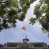 A Spanish flag flies over the Bank of Spain in Madrid