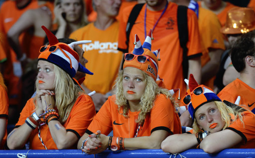 Dutch fans stand dejected after the Euro 2012 soccer championship Group B match between the Netherlands and Denmark in Kharkiv , Ukraine, Saturday, June 9, 2012. The Netherlands lost the match to Denmark 0-1. (AP Photo/Geert Vanden Wijngaert)