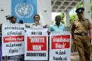 Sri Lankan activists of the "Dead and Missing Person's Parents" organisation hold placards as they take part in a demonstration outside the United Nations offices in Colombo
