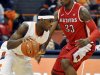 Syracuse's C.J. Fair, left, drives against Rutgers' Wally Judge during the first half of an NCAA college basketball game in Syracuse, N.Y., Wednesday, Jan. 2, 2013. (AP Photo/Kevin Rivoli)