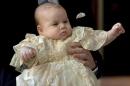 Britain's Prince William carries his son Prince George as they arrive for his son's christening at St James's Palace in London