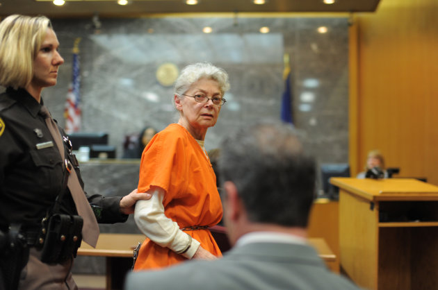Sandra Layne, 75, looks over at her husband Fred Layne moments after she is sentenced in Oakland Circuit Court Thursday, April 18, 2013, in Pontiac, Mich. Layne, convicted of murder in the fatal shooting of her teen grandson, was sentenced to at least 22 years in prison Thursday, despite her desperate plea to a judge to spare her from dying behind bars. (AP Photo/Detroit News, Max Ortiz) DETROIT FREE PRESS OUT; HUFFINGTON POST OUT (Max Ortiz/The Detroit News) 2013