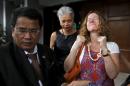 Wife of Canadian teacher Bantleman reacts after their lawyer reads papers from the high court in Jakarta